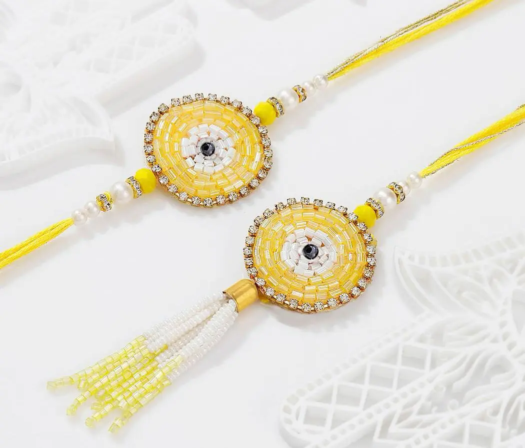 yellow thread on rakshabandan